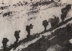 The Red Army trudging on snow covered mountains during the 1935 Long March. XINHUA